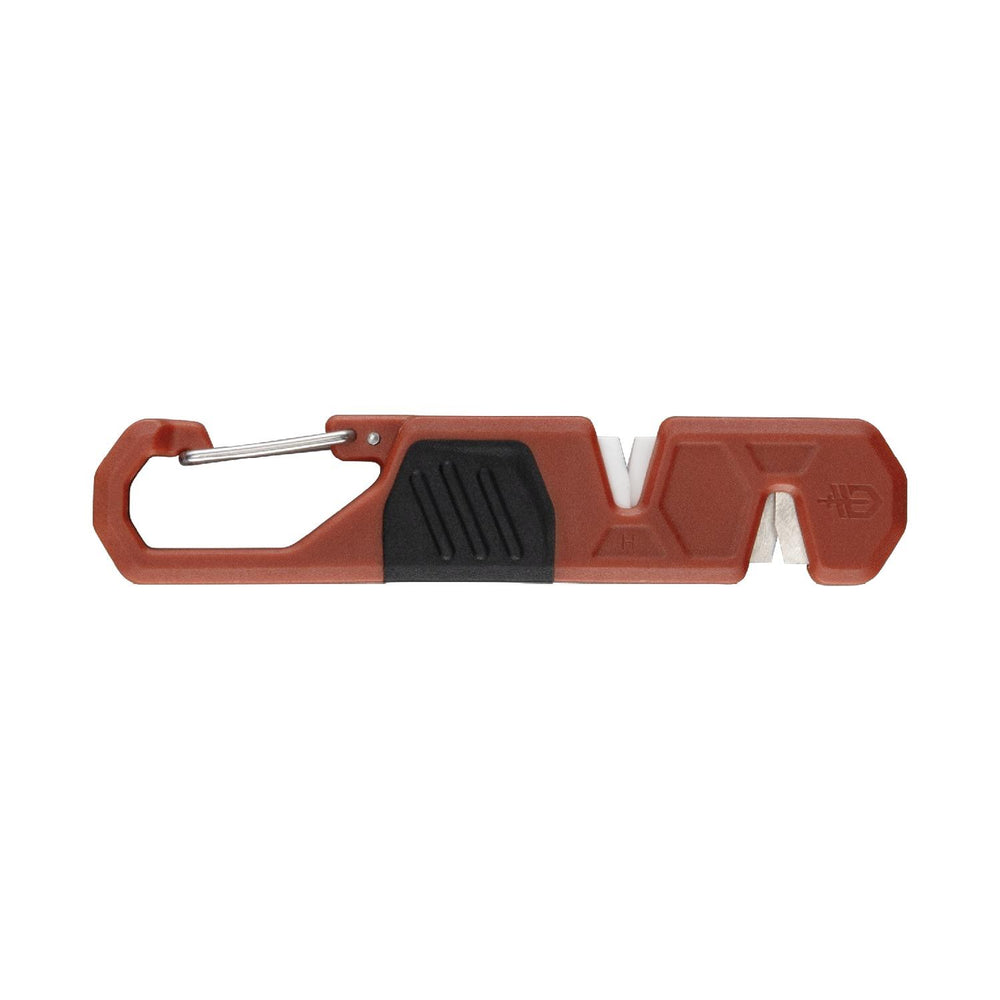 Gerber Edgefield sharpener shown from the reverse side, orange moulded body with integrated carabiner gate and coarse and fine sharpening notches