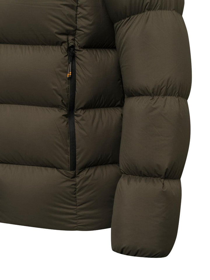 Close-up of the down jacket's olive chest panel, picking out the vertical zipped pocket, matte ripstop shell and the puffed baffle construction.