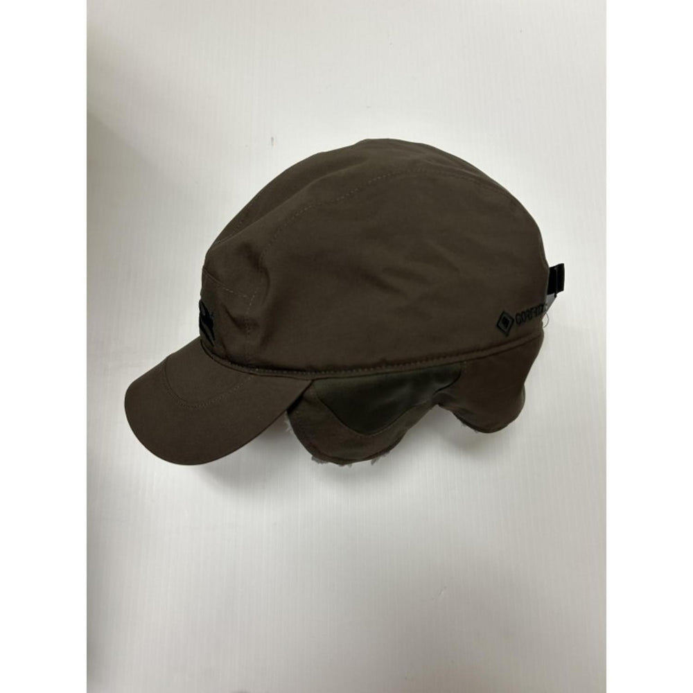 Sitka Blizzard GTX hat in Earth brown, side view showing the short curved peak and the ear flap folded up against the crown.