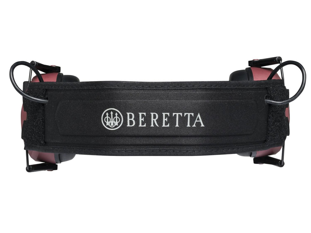 Top-down view of the Beretta earmuff headband, a black padded strap printed BERETTA in white with the rose-pink cups either side