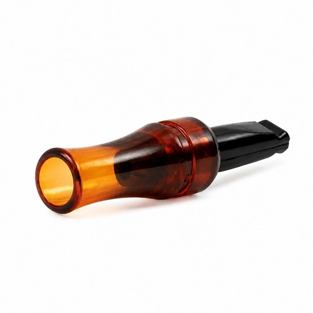 Mjoelner crow call at a three-quarter angle, showing the tortoiseshell-effect amber barrel and the flared bell end