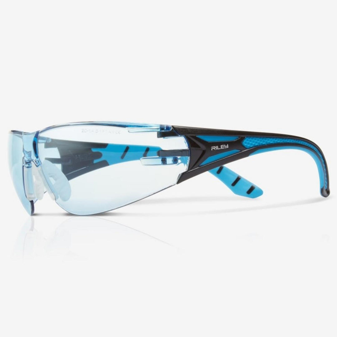 Riley Stream Blue safety glasses with blue tinted lens, black and blue frame, side view with Riley name on the arm