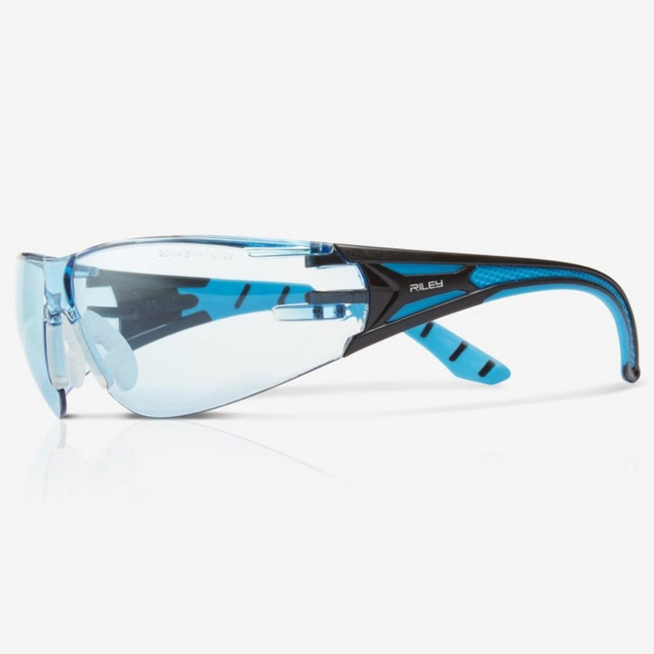 Riley Stream Blue safety glasses with blue tinted lens, black and blue frame, side view with Riley name on the arm