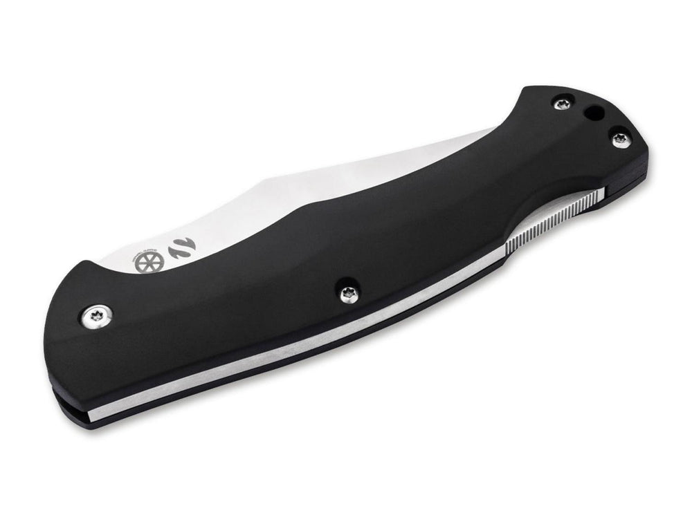 Böker Magnum Echidna folding knife closed, black handle with serrated spine and satin blade edge, angled view