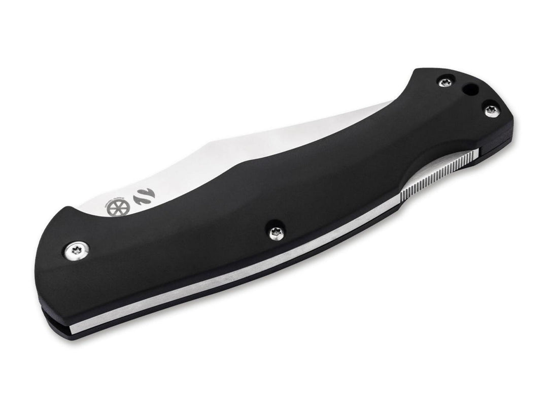 Böker Magnum Echidna folding knife closed, black handle with serrated spine and satin blade edge, angled view