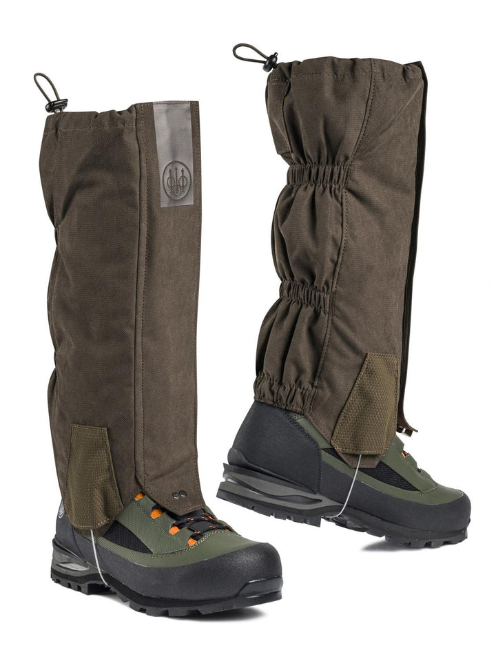 Beretta Quiet Stride gaiters in Brown Bark dark brown, pair worn over hiking boots, three-quarter view with Beretta logo patch