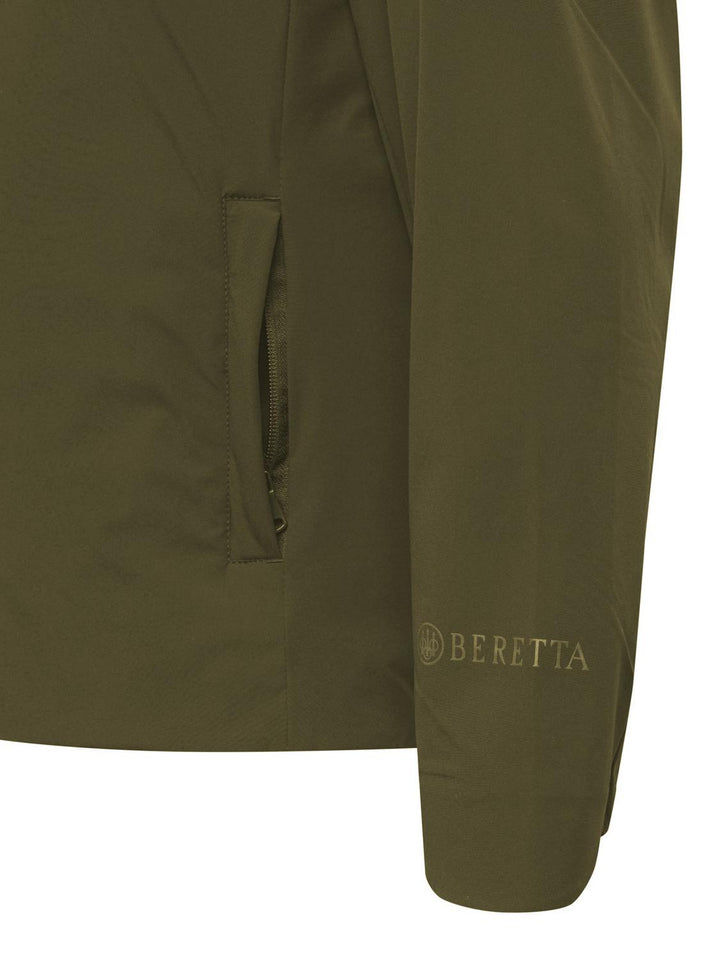 Beretta Pursuit 2 in 1 Jacket in olive green, close-up of the zip pocket and Beretta logo on the sleeve