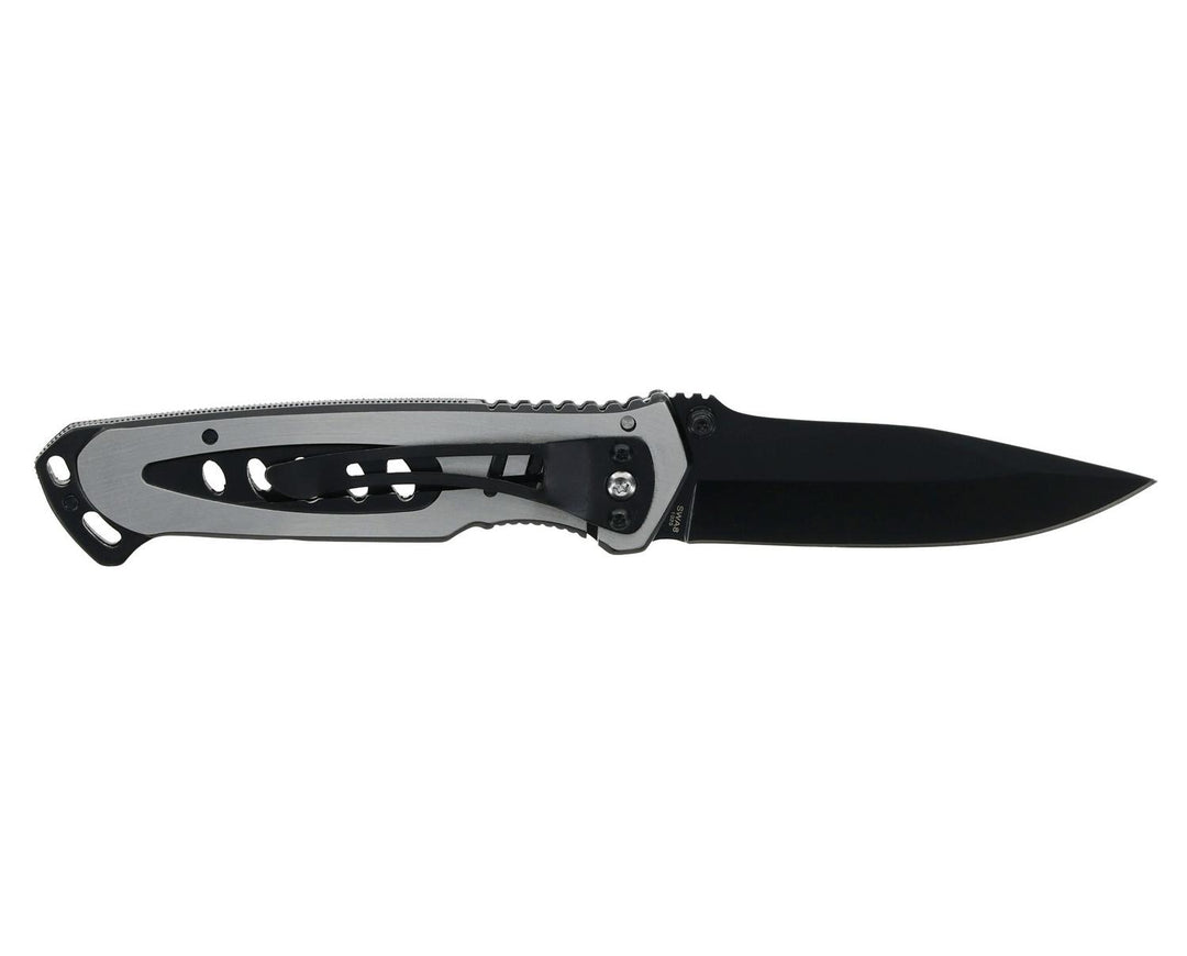 Smith & Wesson Extreme Ops folding knife open and laid horizontally, black blade pointing right with the silver cut-out handle and thumb studs visible