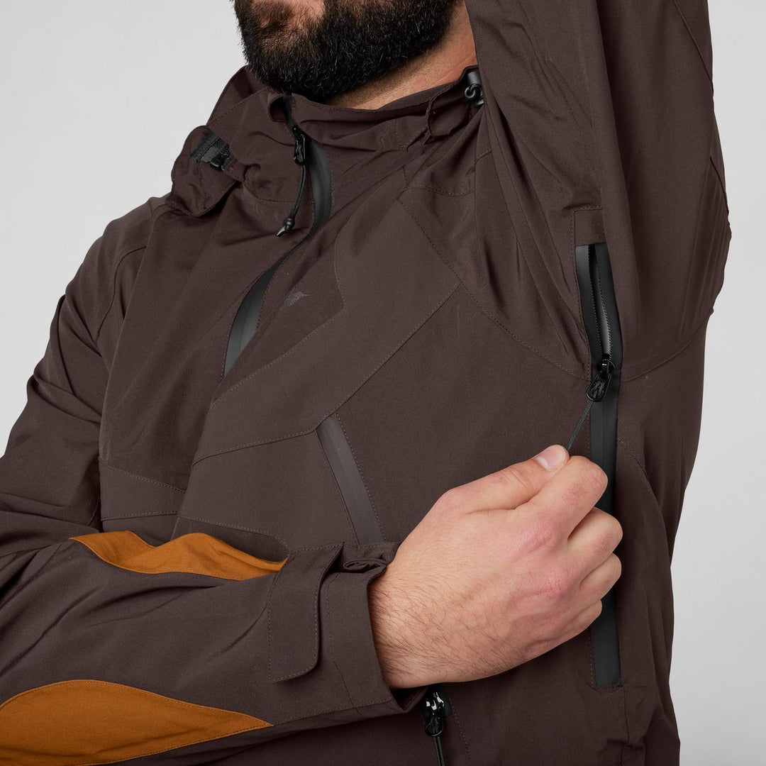 Close-up of the hood and chest zip pocket on the Seeland Dog Active jacket, worn