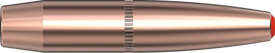 Hornady 307gr SUB-X .338 bullet lying horizontally, copper jacket with knurled cannelure and red Flex Tip polymer point, side view