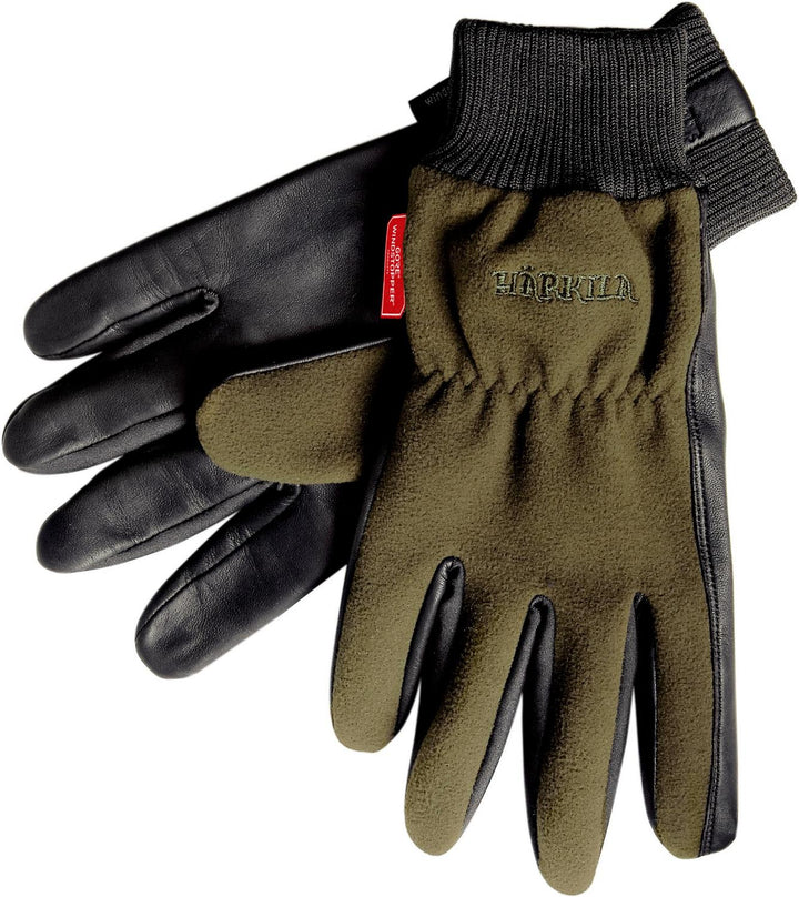 Harkila Pro Shooter gloves shown from a slightly different angle, the red Harkila tab visible at the cuff of the black leather and olive fleece glove.