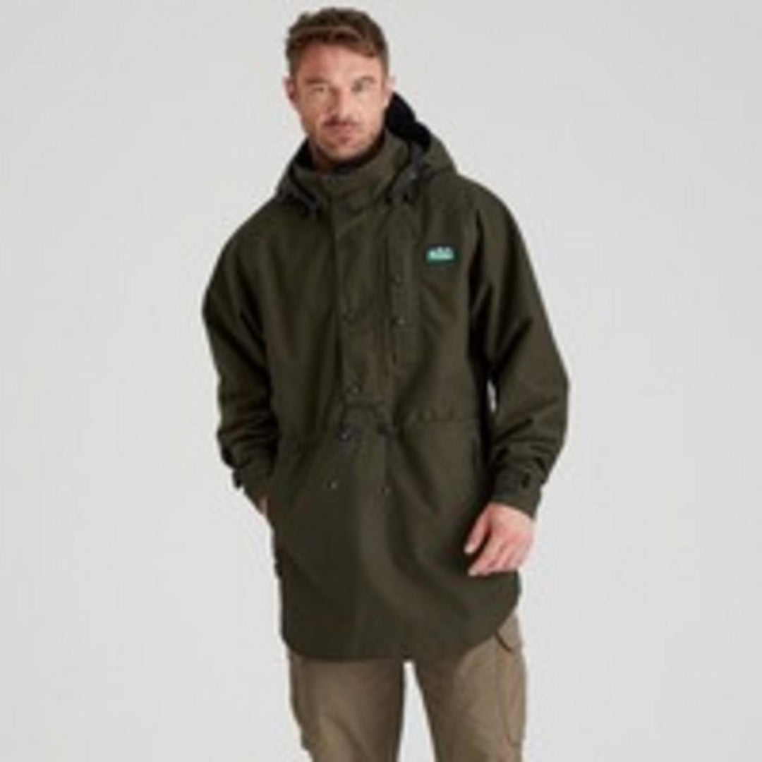 Ridgeline Monsoon Classic Smock in Deep Forest green, front view on a model with hood down, showing the half-zip placket and Ridgeline chest badge