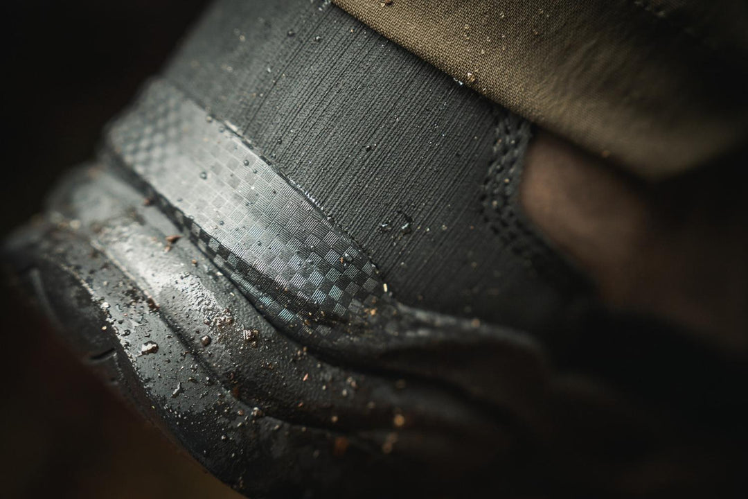 Close-up of the ankle gusset and ridged sole edge on the Seeland Enduro Explore Mid boot