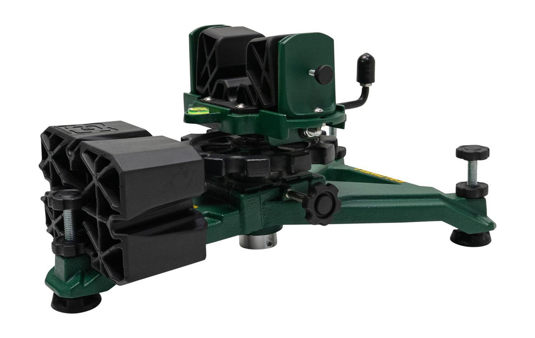 Caldwell Rock 2 shooting rest in green cast metal with a black moulded forend cradle, shown three-quarter from the side with its levelling feet and matching black rear bag alongside