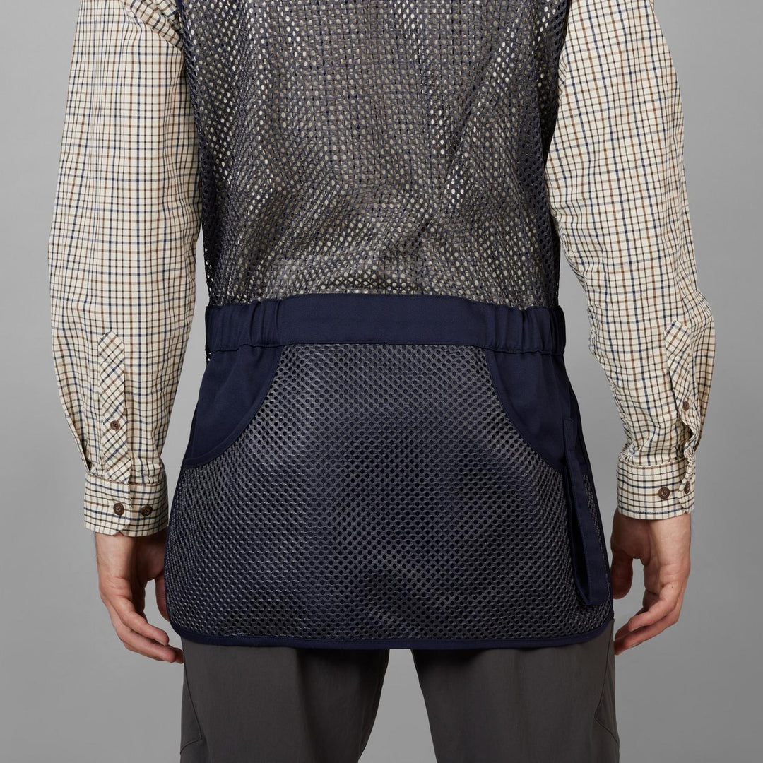 Rear view on a model: Skeet II navy waistcoat mesh back and elasticated waist strap over a check shirt