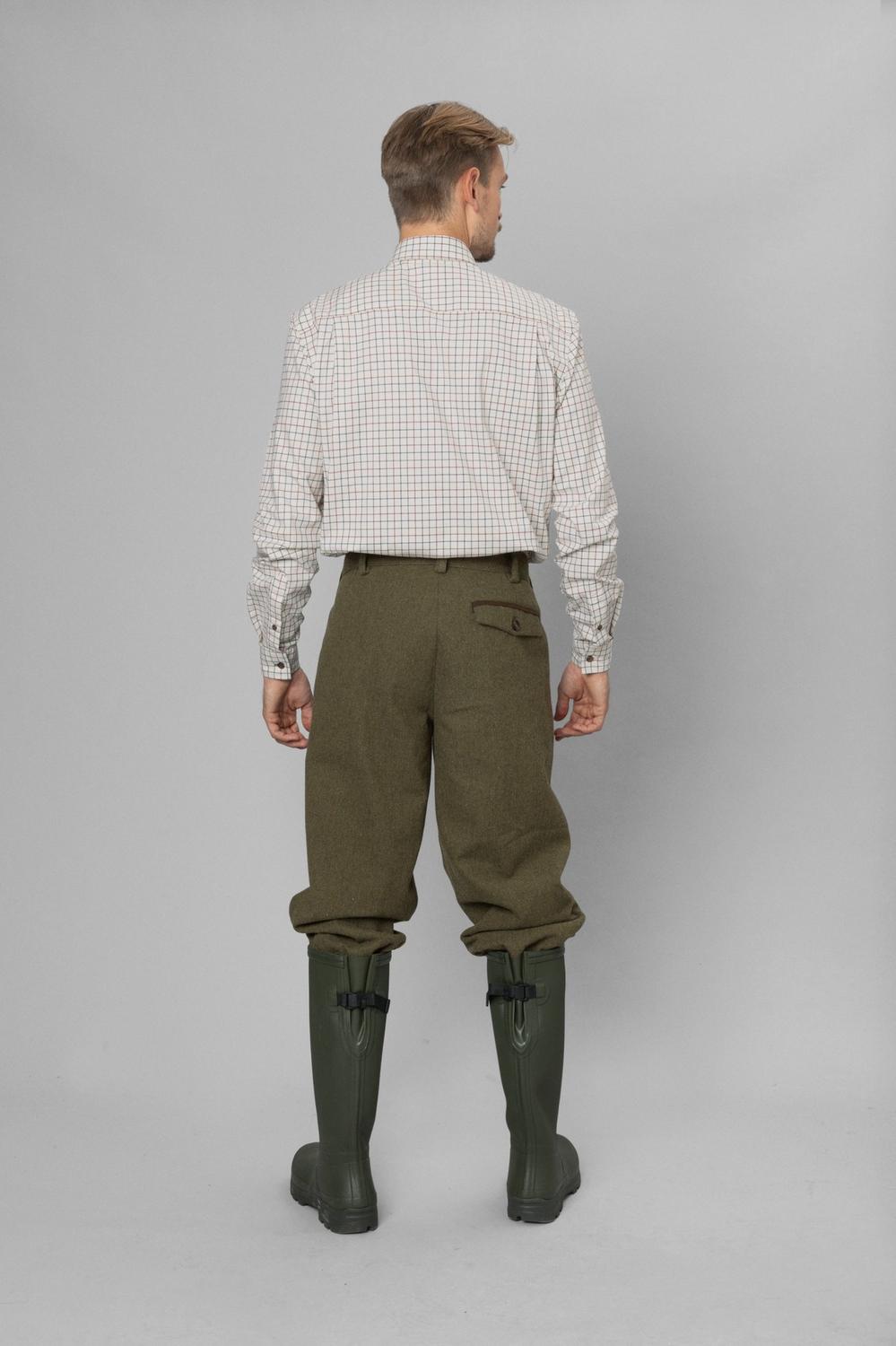 Full-length rear view: model in Seeland Oxford check shirt, olive tweed breeks and green wellingtons