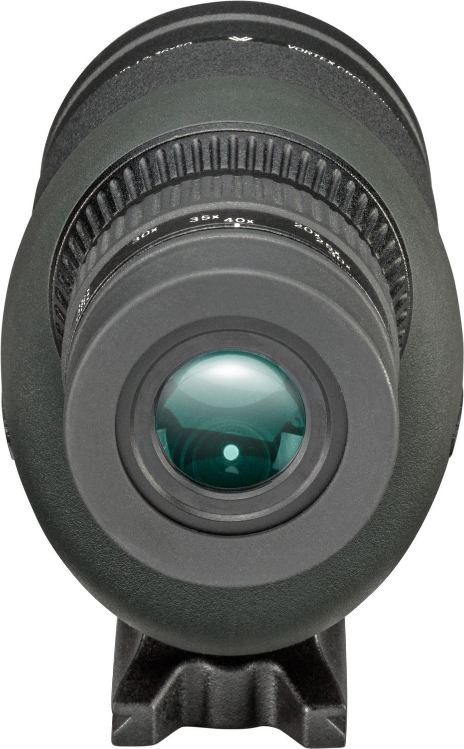 Vortex Crossfire HD 12-36x50 spotting scope seen from the rear, looking straight into the green-coated ocular lens, with the ribbed zoom collar and body behind it.