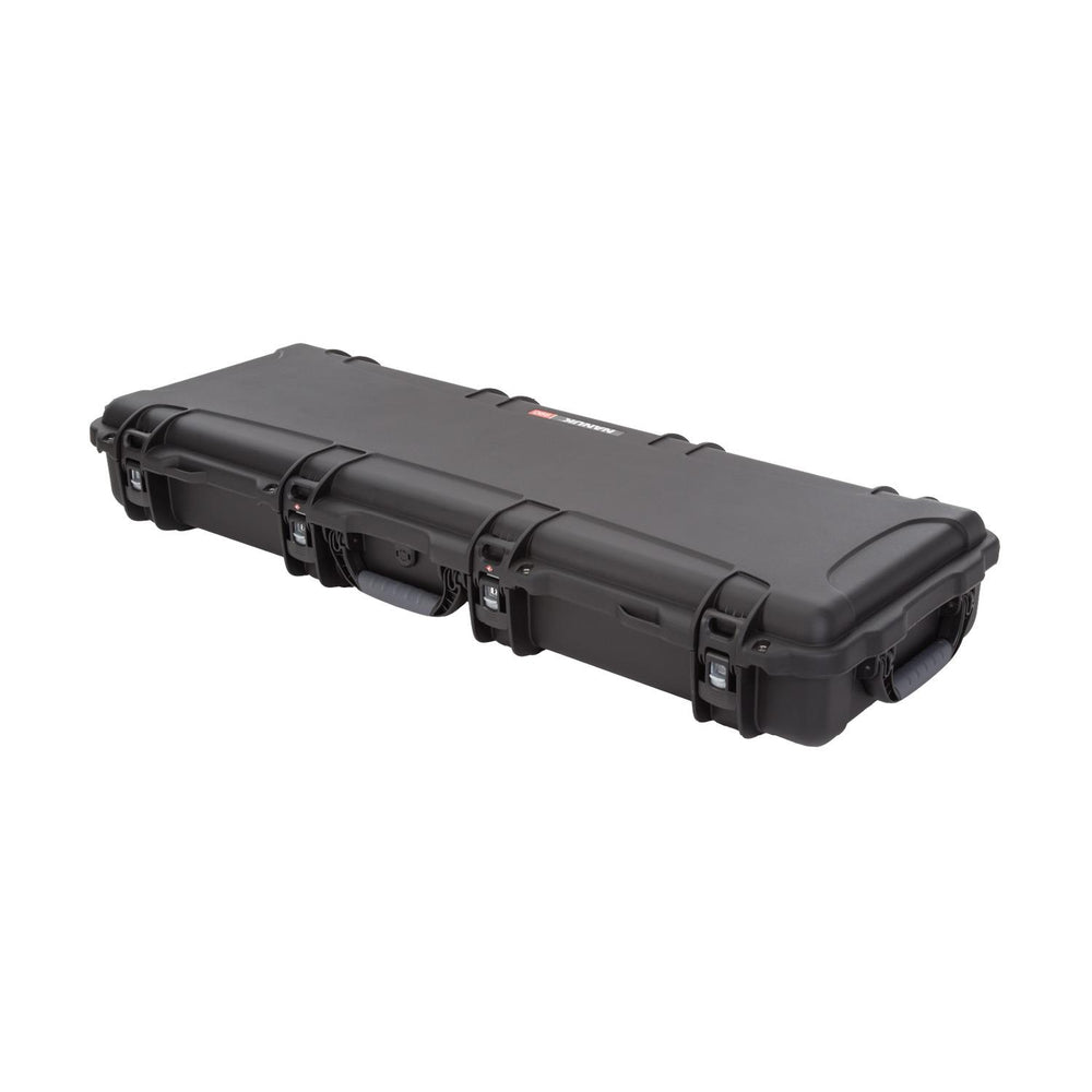NANUK 990 hard case closed, three-quarter view along its length showing the PowerClaw latches and end wheels.
