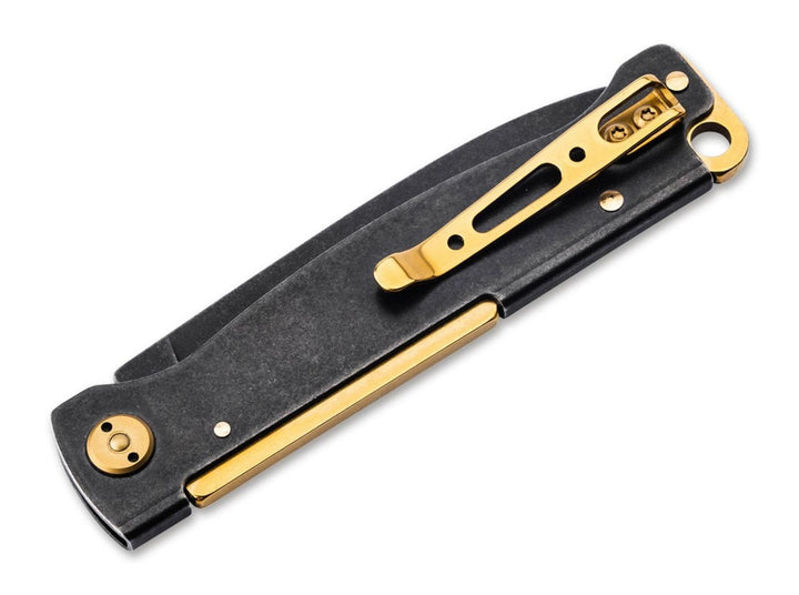 Böker Plus Atlas Black Stonewash Brass, back view showing brass pocket clip and brass liner on black handle