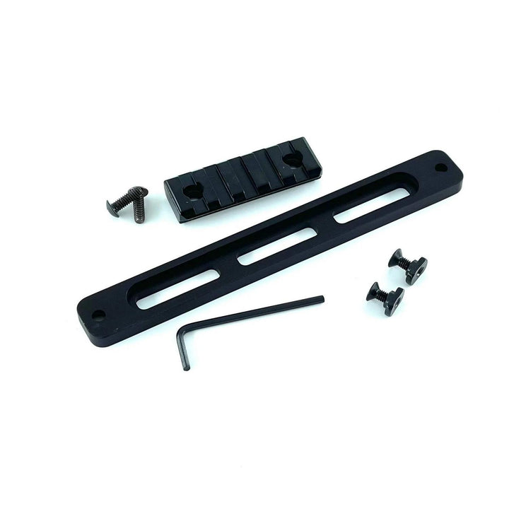 Nieload M-LOK Picatinny rail kit for the MDT Oryx chassis laid out on white: slotted black rail bar, short Picatinny section, hex key and mounting screws