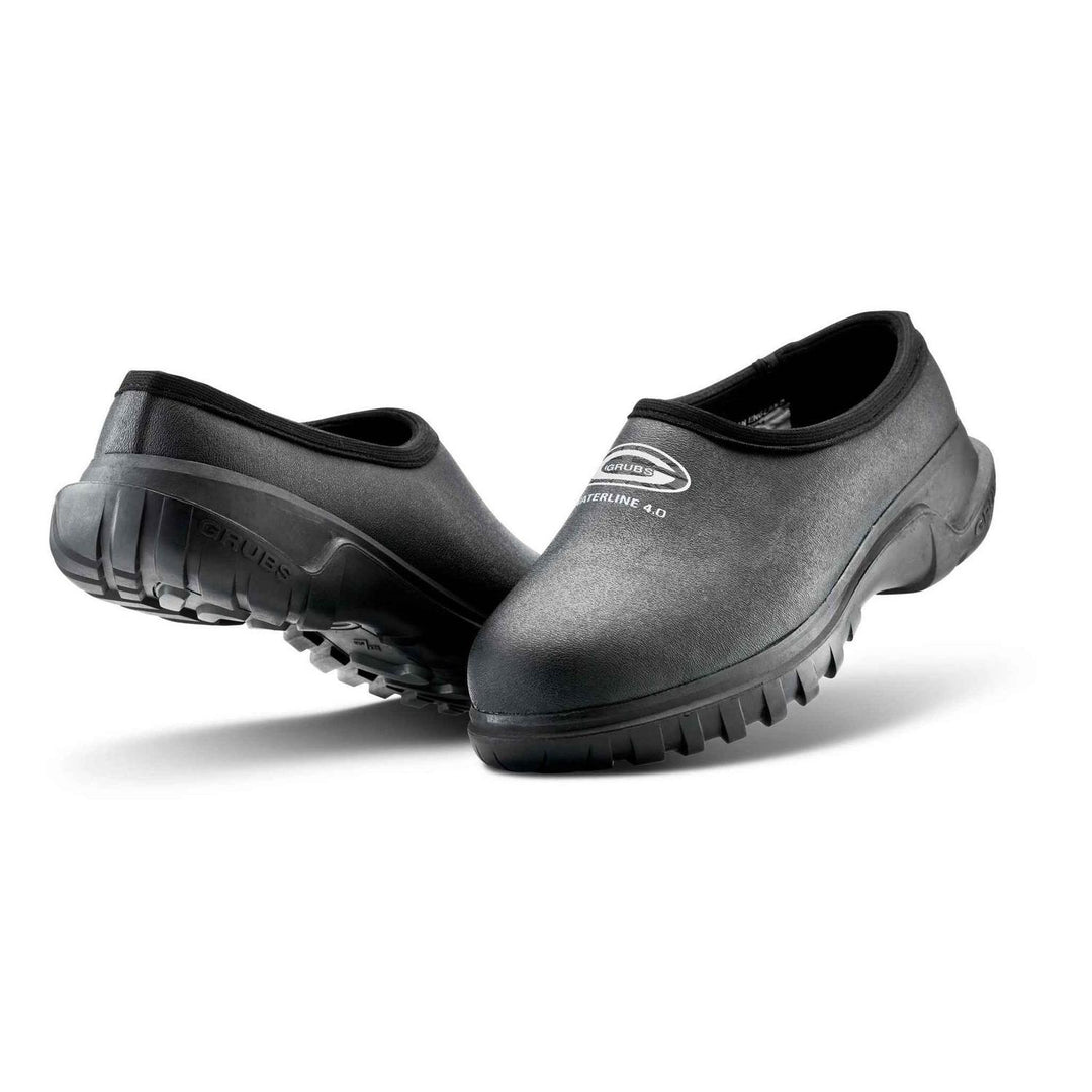 Grubs Waterline 4.0 insulated waterproof clogs in black, pair shown from the front three-quarter with Grubs logo on the upper