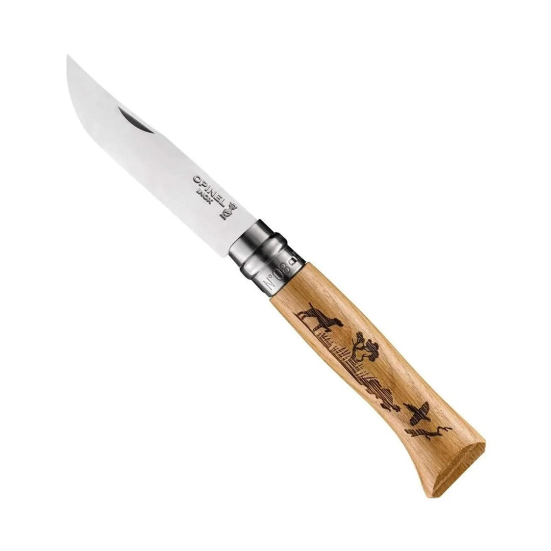 Opinel No.8 stainless steel folding knife, blade open, wooden handle engraved with a pointing dog, reeds, a tree and ducks in flight.