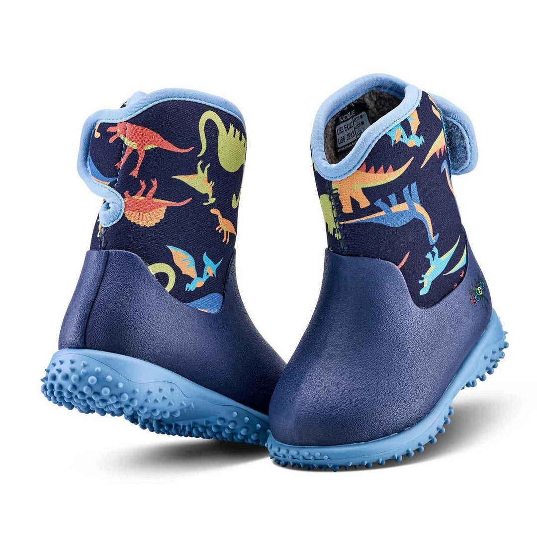 Grubs Muddies Puddle 5.0 toddler wellington boots in navy with dinosaur print upper, light blue trim and sole, pair three-quarter view