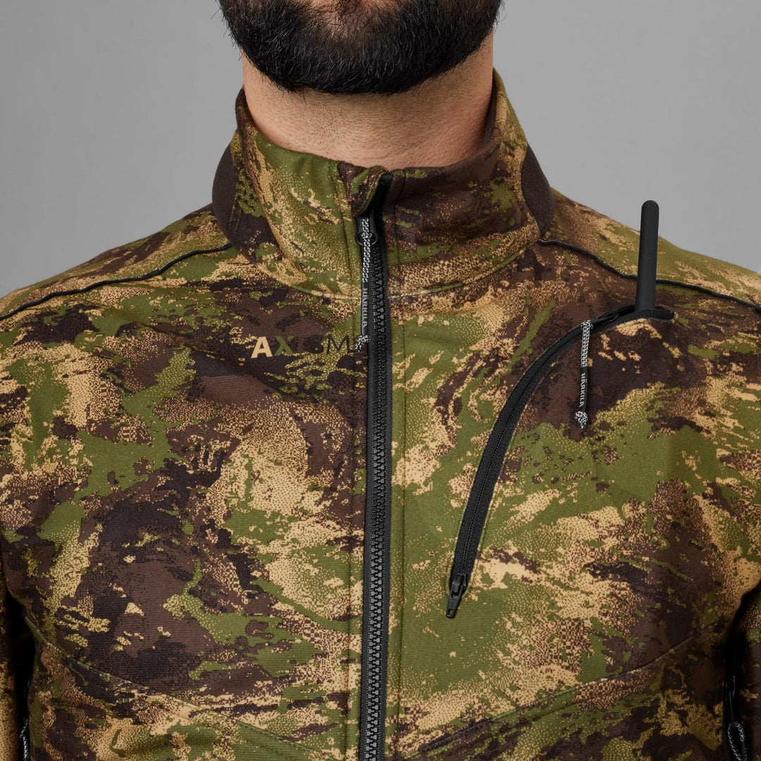 Close-up of the collar and chest zip pocket on the Härkila Deer Stalker camo WSP fleece jacket, worn by a bearded model