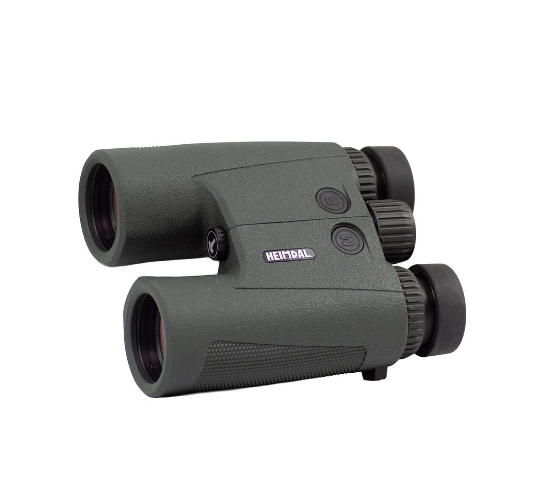 Heimdal XO LRF 10x42 rangefinding binocular in grey armour, three-quarter view showing the objective lenses, laser window and side focus dial