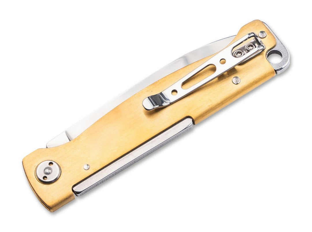 Böker Plus Atlas Brass folding knife, brass handle back view with steel pocket clip and lanyard hole