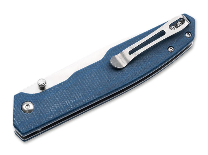 Böker Magnum Deep Blue Canvas folding knife closed, blue textured handle with pocket clip, angled view