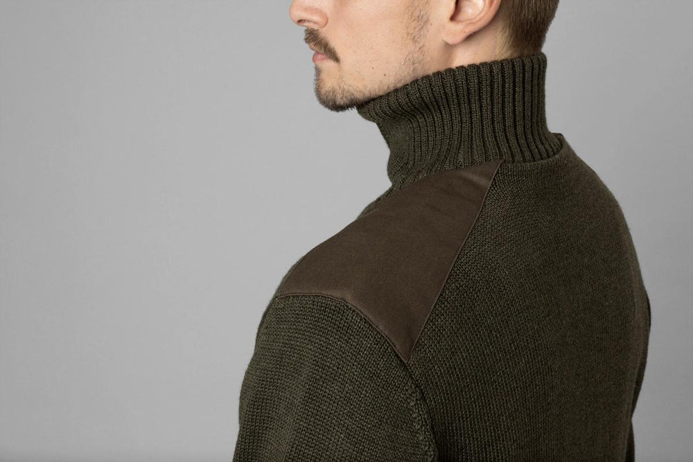 Seeland Haze Windbreaker Knit worn by a model, three-quarter rear view showing the stand collar and shoulder patch