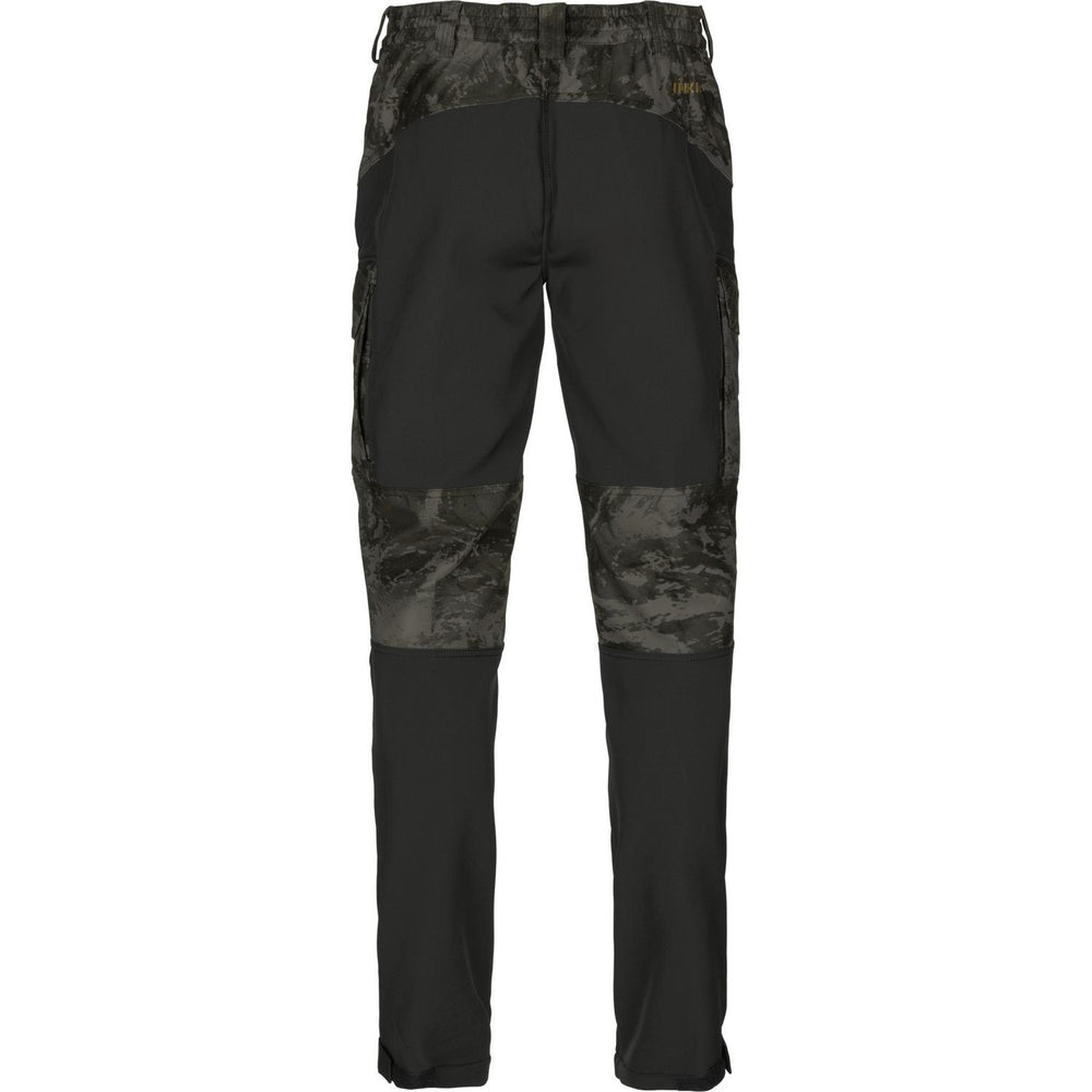 Rear view of the NOCTYX trousers showing the black seat reinforcement, rear cargo pockets and camo waistband
