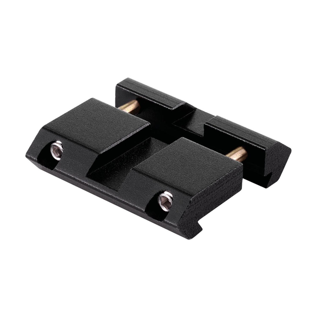 Immersive Optics Weaver mount dovetail insert, two black anodised blocks joined by brass posts, three-quarter view on white