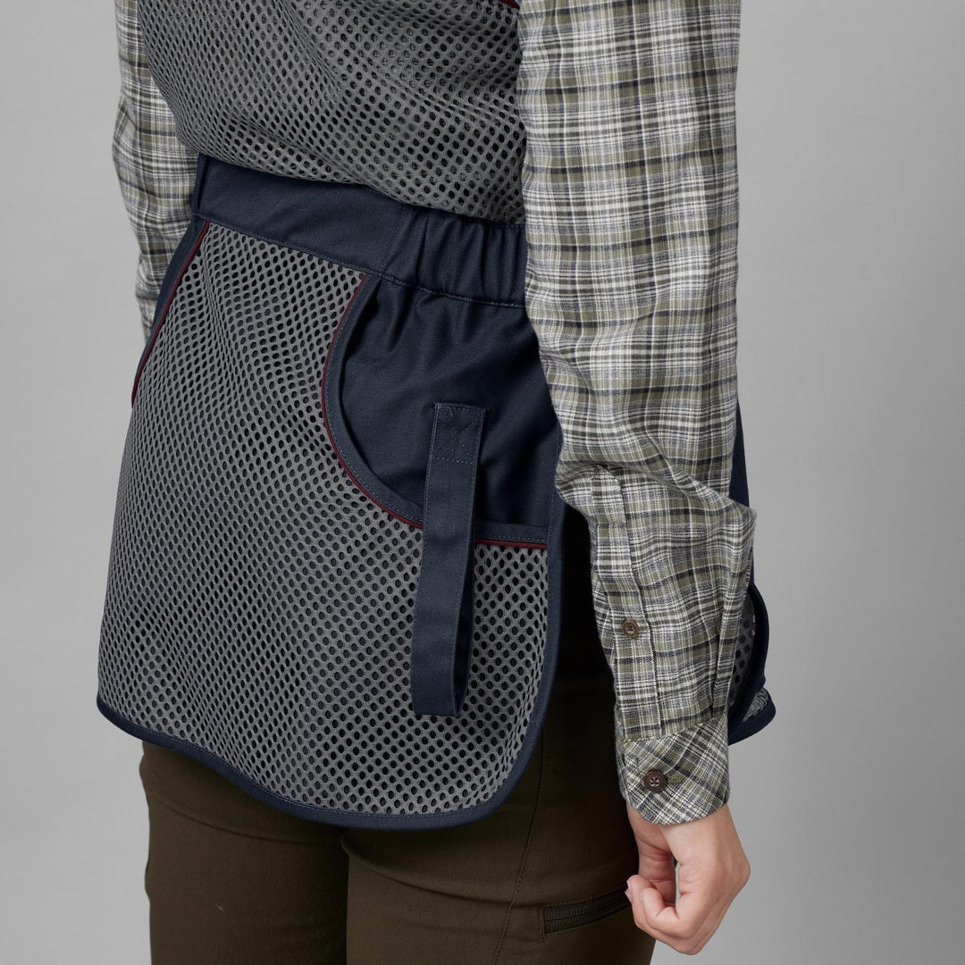Rear three-quarter view of the Seeland Skeet II Lady waistcoat on a model, showing the mesh side panel and the loop tab at the hip