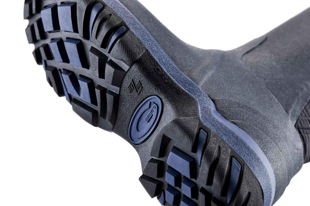Sole of the navy Grubs Rainline 2.0 wellington boot shown from below, black and blue deep-lugged tread