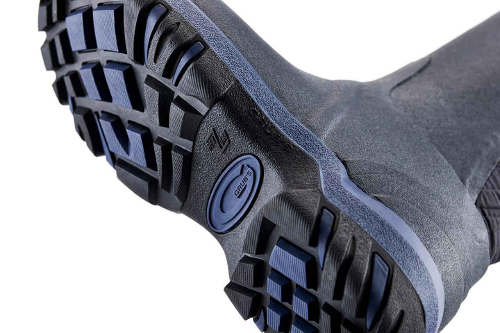 Sole of the navy Grubs Rainline 2.0 wellington boot shown from below, black and blue deep-lugged tread