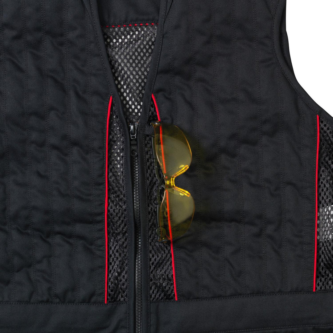 Yellow-lensed shooting glasses tucked into the chest pocket of the black Skeet II waistcoat
