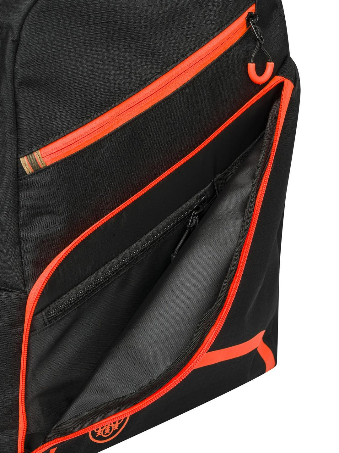 Detail of the black Beretta Challenge Backpack front pocket opened along its orange zip to reveal the internal zipped slip pocket.