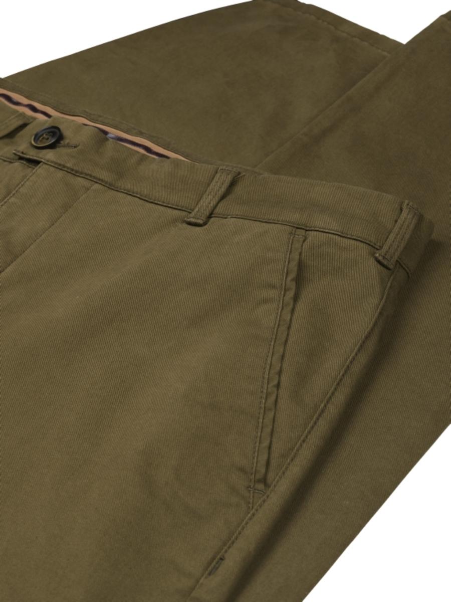 Close-up of the waistband and fly on the olive chinos, with belt loops, hook closure and a contrast striped inner lining visible.