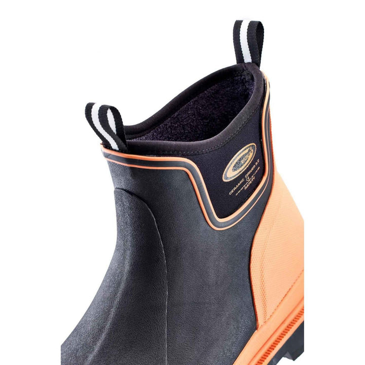 Close-up of black neoprene collar with orange piping and pull loops on Grubs Ceramic Driver 5.0 S5 safety ankle boot