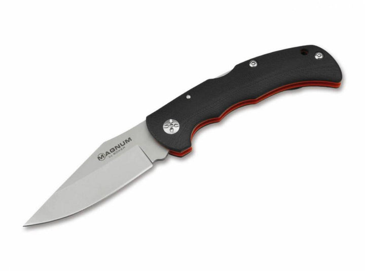 Böker Magnum Most Wanted folding knife with black G10 handle and red liners, open, angled side view