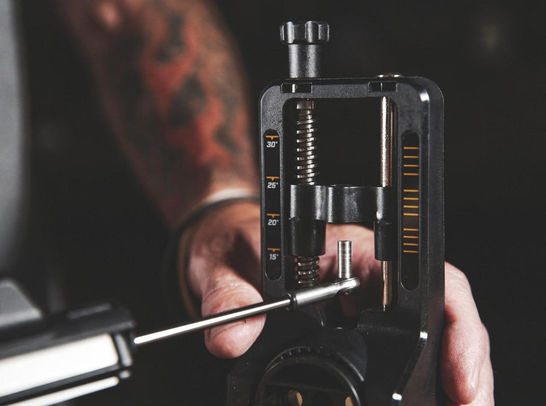 Lifestyle close-up of a hand adjusting the angle on the Work Sharp Precision Adjust knife sharpener