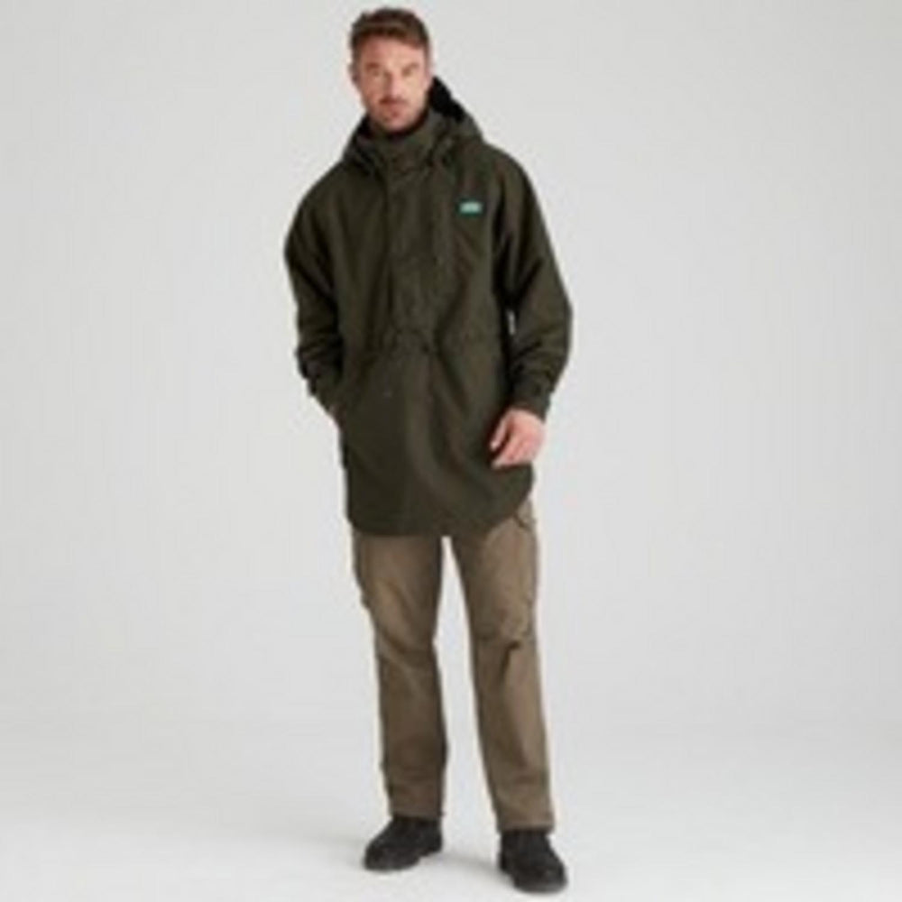 Male model wearing the Ridgeline Monsoon Classic Smock in Deep Forest green with the hood up, full-length front view over tan trousers