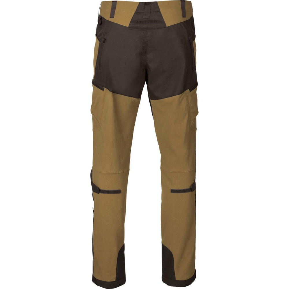 Härkila Ragnar trousers, rear view laid flat: dark brown seat panel over khaki-tan legs with dark brown lower-leg reinforcement