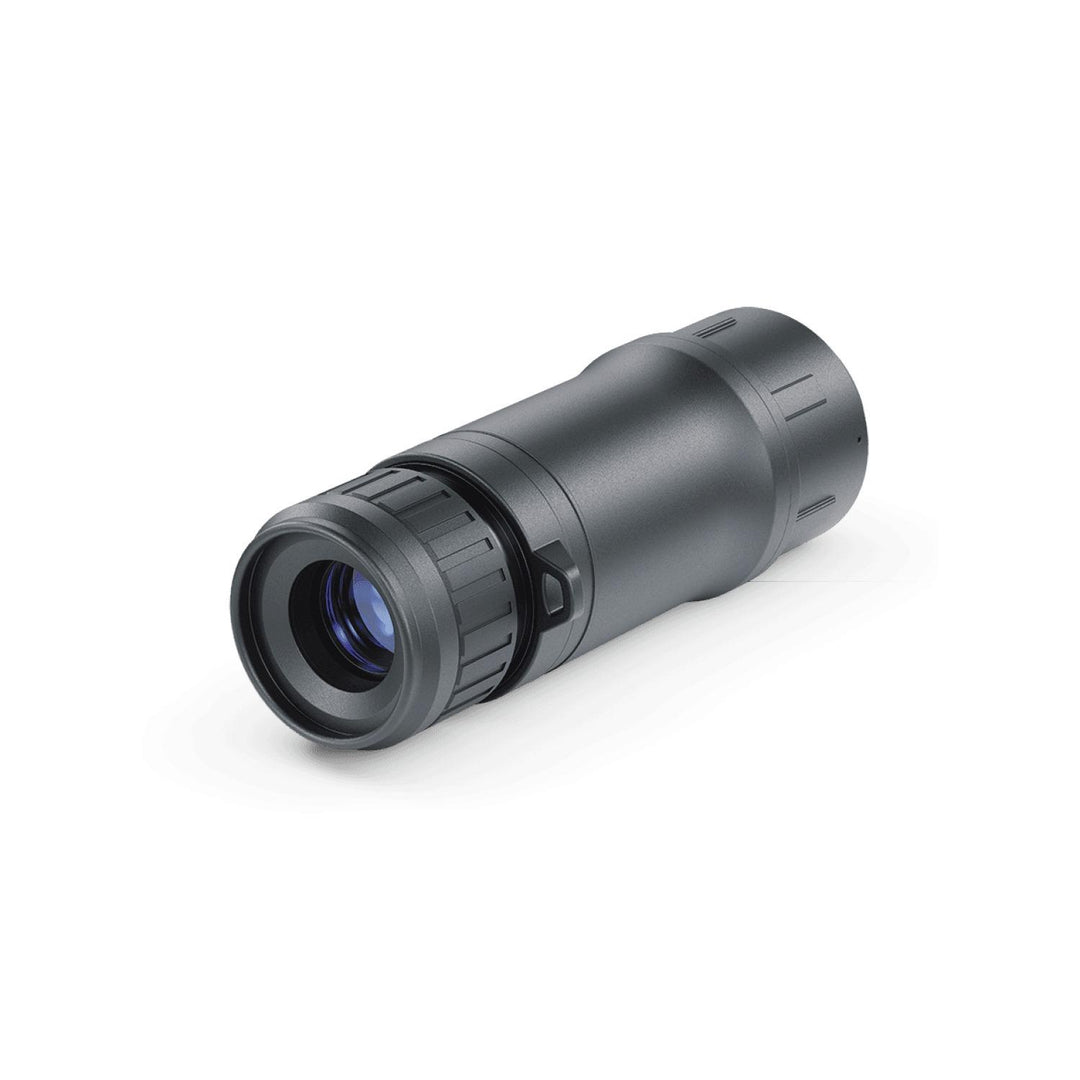 Pulsar 3x20 B monocular seen end-on at a shallow angle, showing the blue-coated lens element inside the tube
