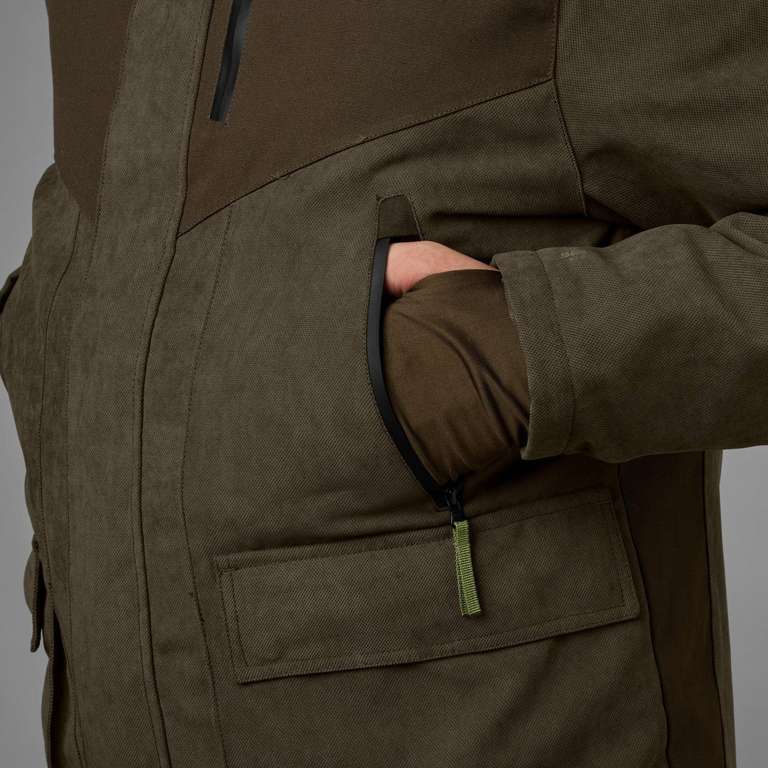 Close-up of a hand in the lower flap pocket of the Seeland Helt II jacket