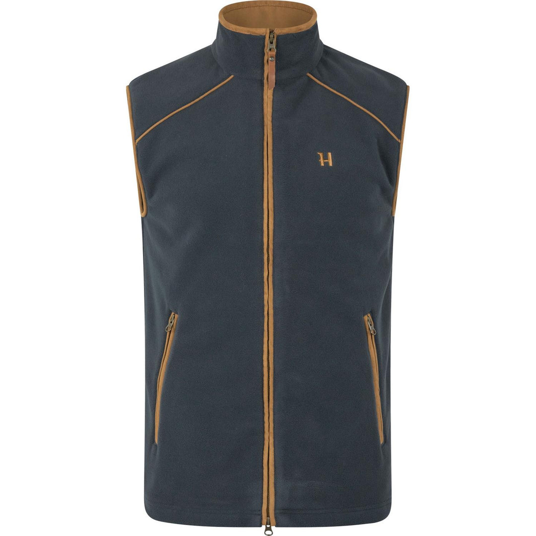 Härkila Sandhem 200 fleece waistcoat in dark navy, front view showing the tan-piped shoulder seams and copper H logo on the chest