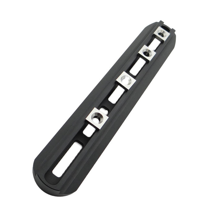 Nieload Sako TRG 42/22 ARCA M-LOK front rail, black slotted rail with silver M-LOK fixing nuts fitted, shown at an angle