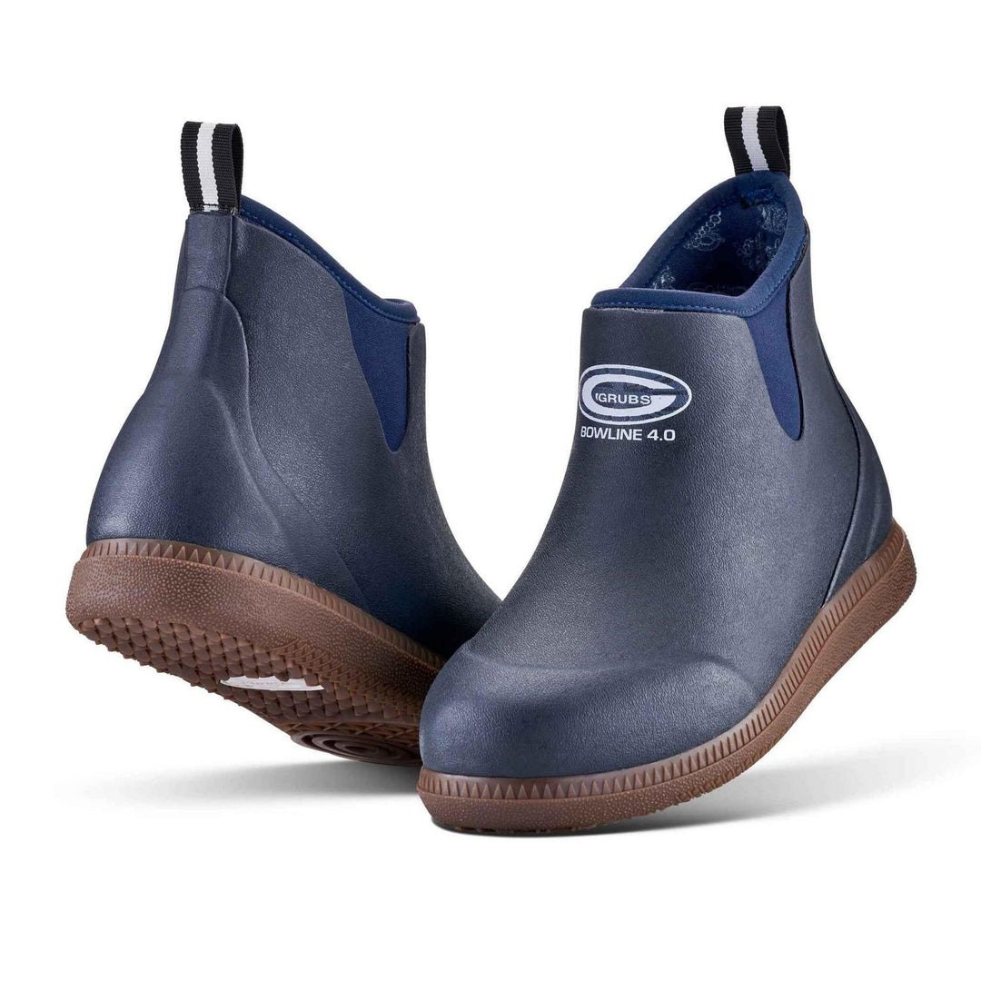 Grubs Bowline 4.0 insulated ankle wellington boots in navy blue with brown sole, pair shown from the front three-quarter